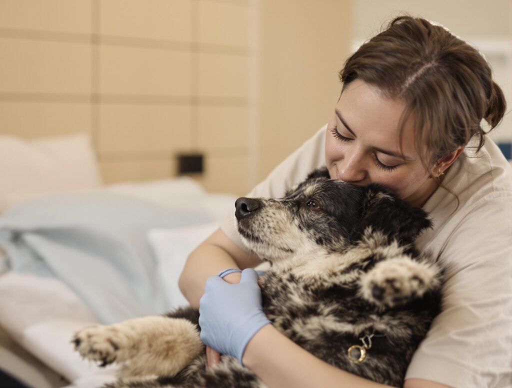 Pet owner providing emotional support to their dog during a seizure, highlighting care and compassion.